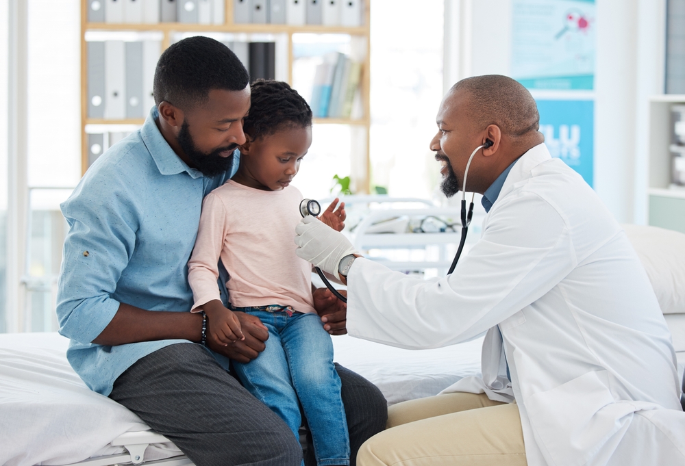Black,Family,,Girl,And,Pediatrician,Doctor,With,Stethoscope,,Consulting,Healthcare